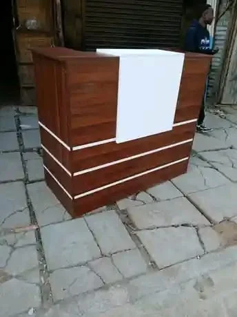 Brown Wood Reception Desk with White Panel
